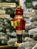 Новогодняя стеклянная елочная игрушка "Щелкунчик с подарком" 