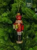 Новогодняя стеклянная елочная игрушка "Щелкунчик с подарком" 
